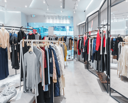 Clothing hanging on a rack in a store