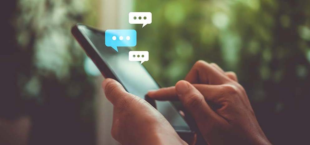 SMS Marketing Person using a phone getting a message and responding